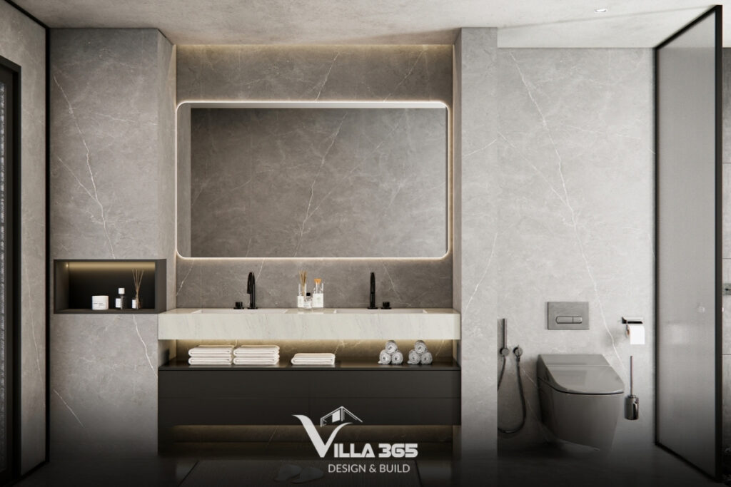 Phòng tắm mang sắc thái hiện đại tối giản với gạch nhám màu xám chống trơn trượt và chậu rửa đôi tích hợp đèn LED