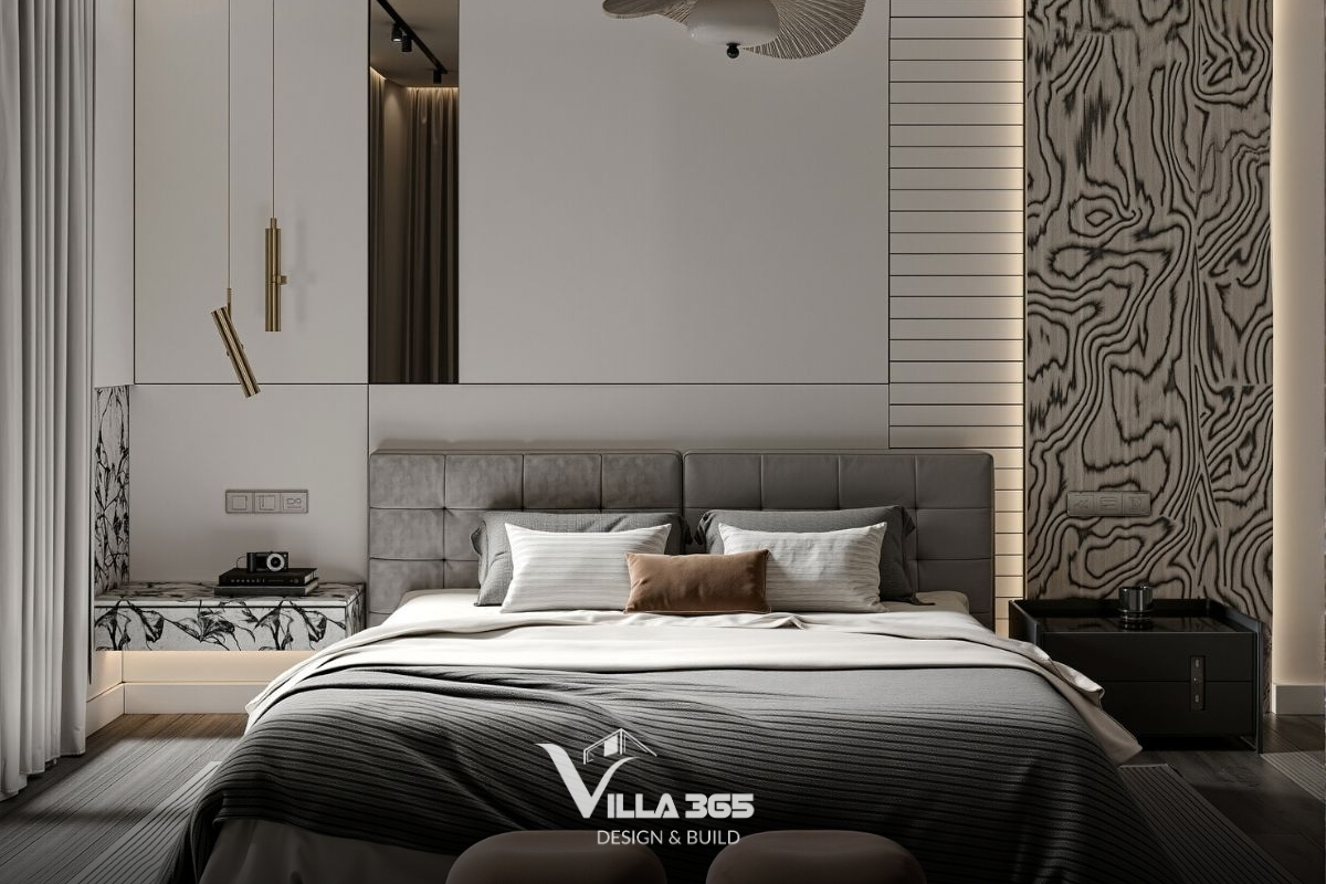 Phòng làm việc trang bị tủ sách cao kịch trần với sự kết hợp giữa khung gỗ tối màu và mặt lưng ốp đá Marble trắng vân mây