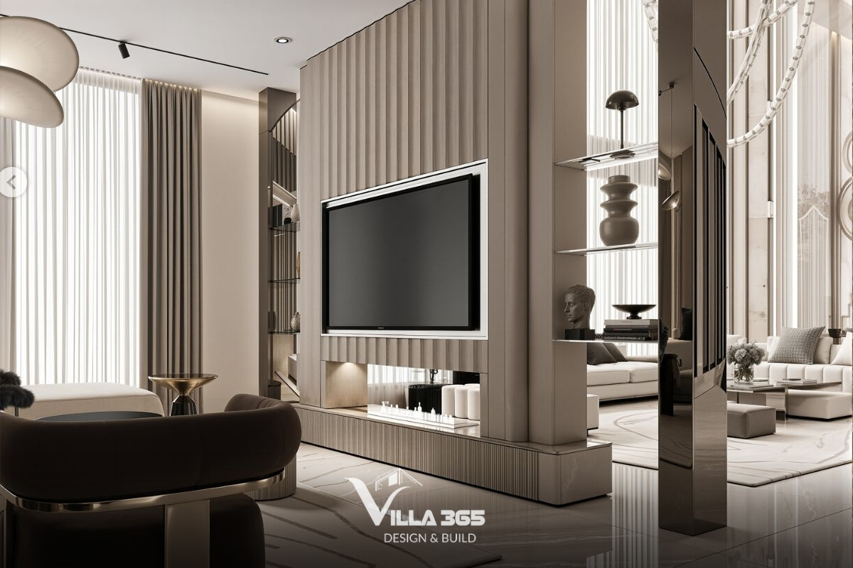 Bức vách đóng vai trò ngăn cách phòng khách chính - phụ, nhưng vẫn giữ được sự kết nối nhờ các kệ kính trong suốt trưng bày các món đồ decor gốm sứ tối màu