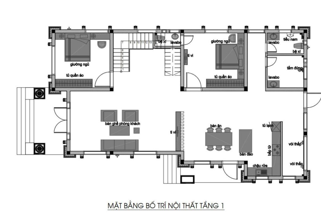Tầng trệt của biệt thự tân cổ điển là trái tim của ngôi nhà — nơi phòng khách trung tâm kết nối với bếp & bàn ăn, phòng thờ và sân vườn theo một luồng sinh hoạt tự nhiên.