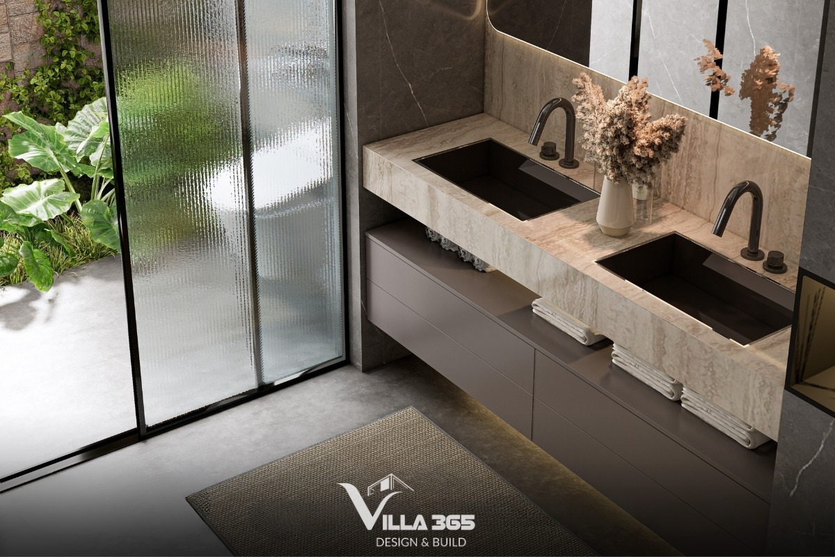 Thiết kế chậu âm hình chữ nhật màu đen sành điệu, đặt trên mặt bàn đá marble vân gỗ sáng màu 