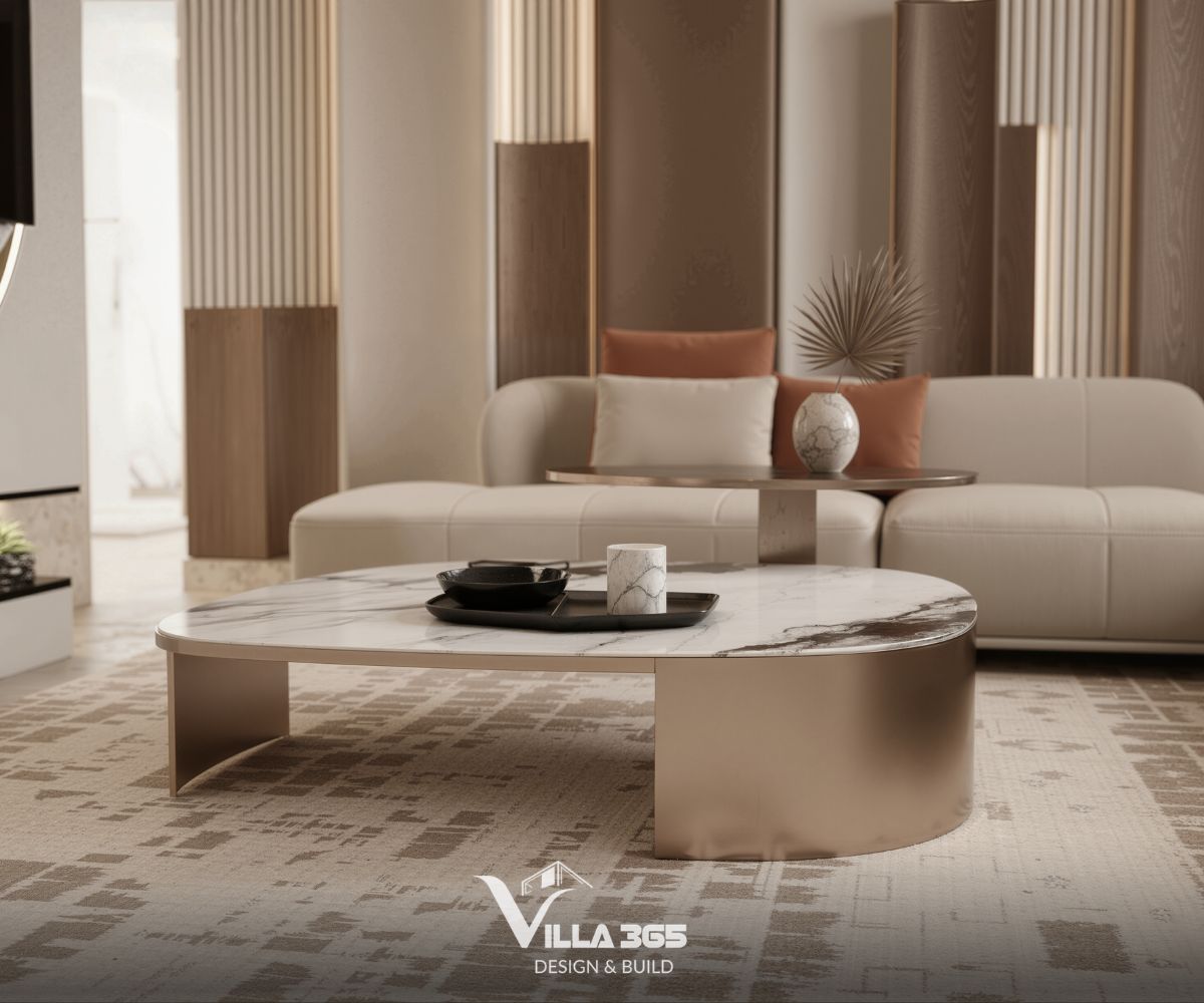 Mặt bàn bằng đá Marble trắng vân mây kết hợp với chân bàn kim loại màu đồng và những chiếc gối màu cam đất