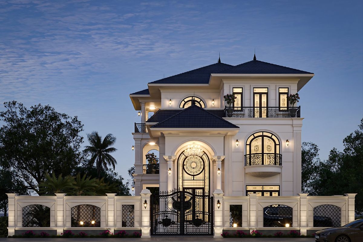 20+ Mẫu biệt thự 3 tầng 6 phòng ngủ đẹp & giải pháp mặt bằng tối ưu 2026 11 Gam trắng kem, be, ghi sáng kết hợp đá ốp và ánh sáng mặt tiền giúp biệt thự tân cổ điển thêm chỉn chu, đẳng cấp (Ảnh: Sưu tầm)