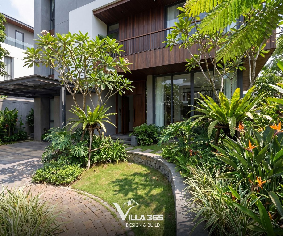 Eco Vista Home - Biệt thự phố “nấp” vào khoảng xanh thiên nhiên 13 Lối đi lát gạch thẻ ở sân trước tạo một đường cong mềm mại, cân bằng lại nét vuông vức của hình khối kiến trúc