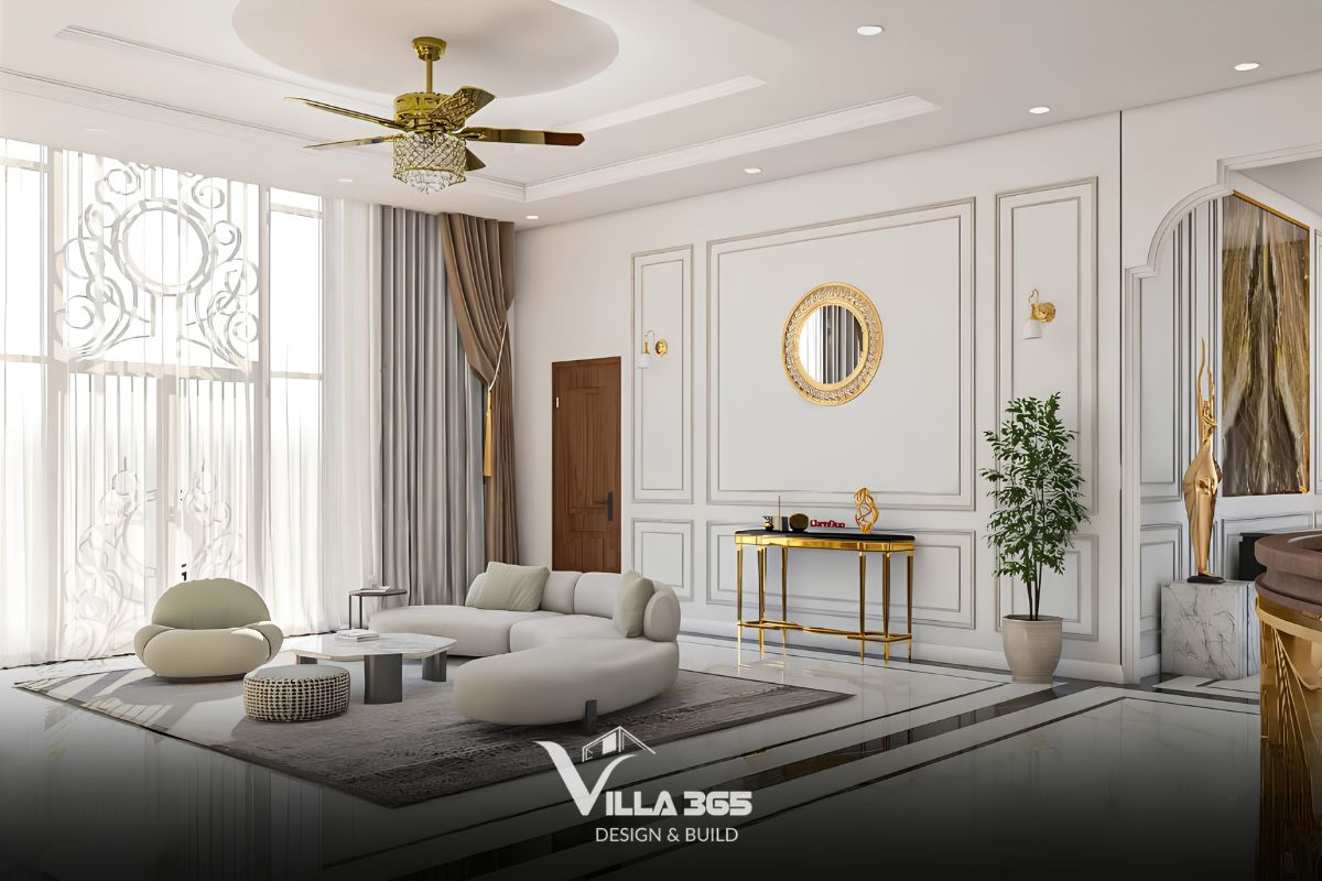 Bộ sofa chính sở hữu kiểu dáng uốn lượn mềm mại màu trắng kem, kết hợp cùng ghế thư giãn và đôn tròn đồng điệu 