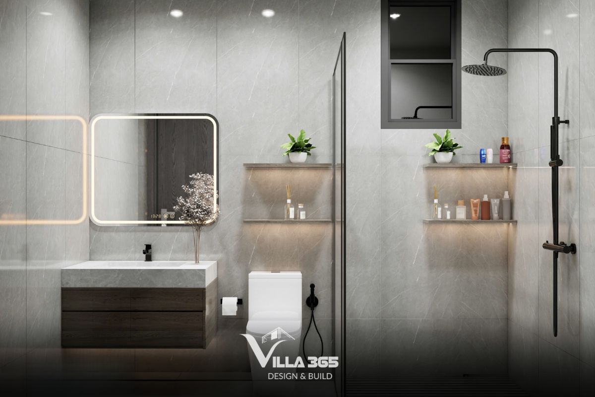 Phòng tắm được chia dọc làm hai khu vực rõ rệt bằng một vách kính cường lực, giúp ngăn nước từ khu tắm đứng sang khu vệ sinh khô 