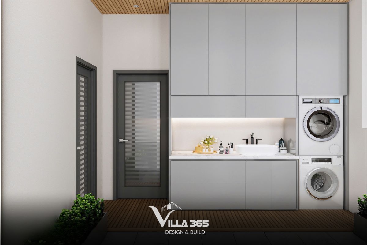 Khu vực giặt phơi tập trung vào việc tối ưu hóa diện tích với hệ tủ lưu trữ kịch trần và lavabo tiện ích