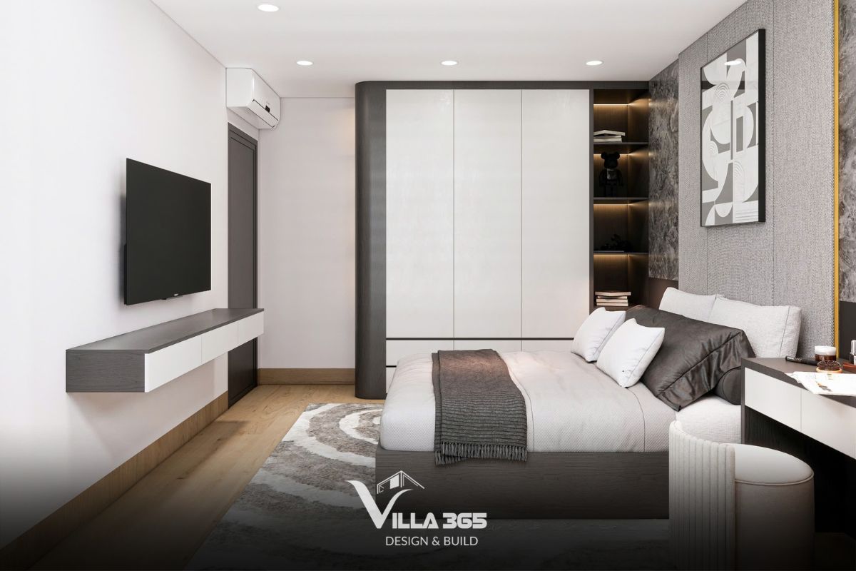Hệ tủ âm tường màu trắng đồng điệu với màu tường giúp giảm cảm giác chật chội, tận dụng triệt để chiều cao căn phòng để lưu trữ 
