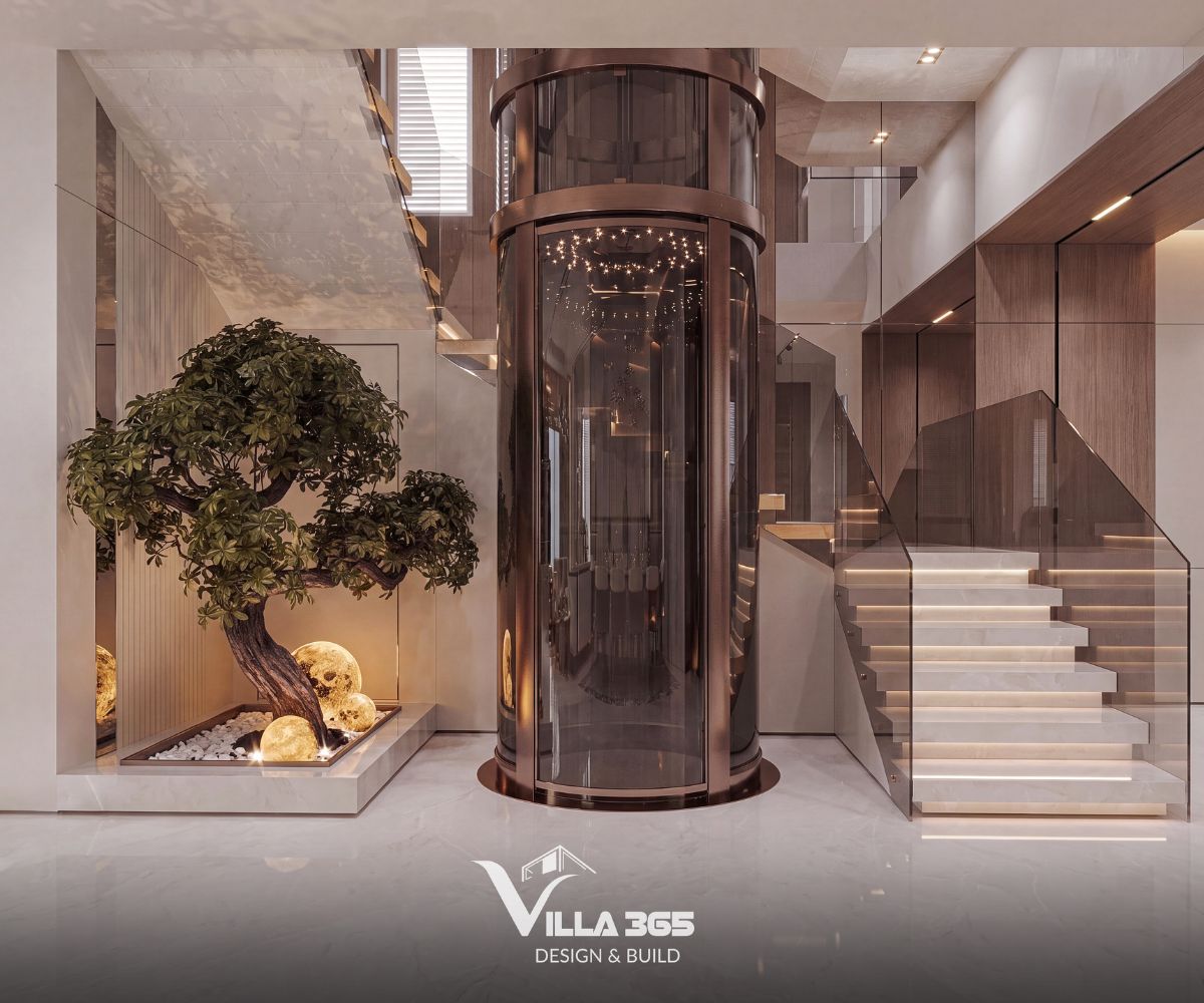 Thiết kế nội thất Grace Villa - Ốc đảo thanh lịch giữa phố thị nhộn nhịp 10 Thiết kế thang máy kính tròn kết hợp cầu thang bộ hiện đại và tiểu cảnh cây xanh nội thất tinh tế